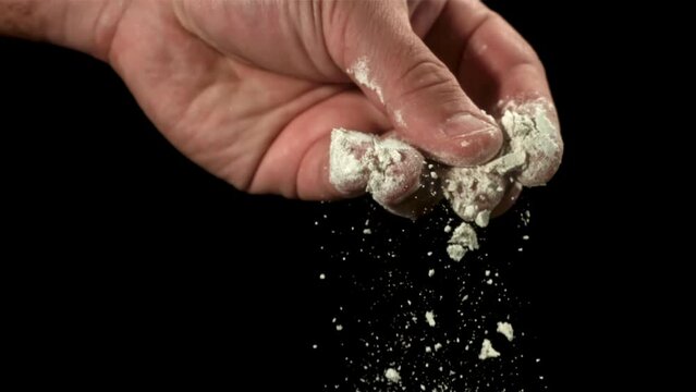 Flour falls from the cook's hand. Filmed on a high-speed camera at 1000 fps. High quality FullHD footage