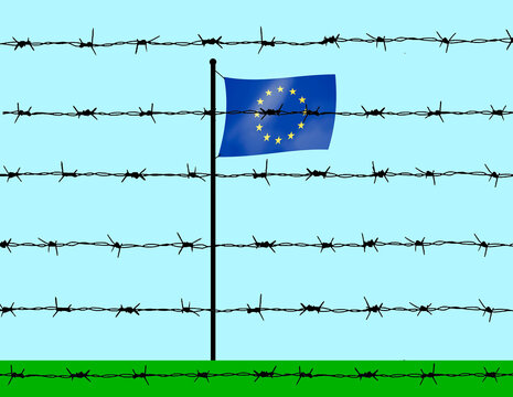 European union flag behind barbed wire under sky