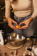 A close-up of the process of making New Year's gingerbread cookies in an atmospheric kitchen at home. Christmas mood