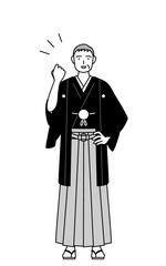 ガッツポーズをする紋付袴姿のシニア男性、お正月の初詣や結婚式で