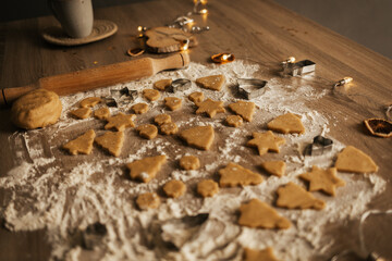 A close-up of the process of making New Year's gingerbread cookies in an atmospheric kitchen at home. Christmas mood. Recipe for New Year's treats