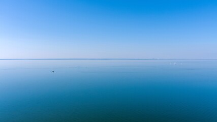 Aerial view of a sailboat in Mobile Bay