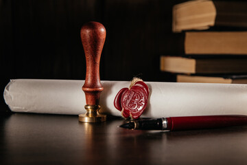 Notary's public pen and document with wax stamp on wooden table