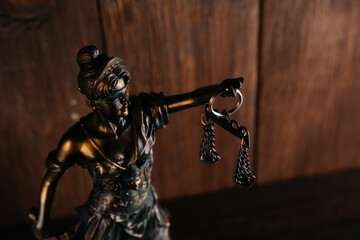 Lady Justice on wooden background