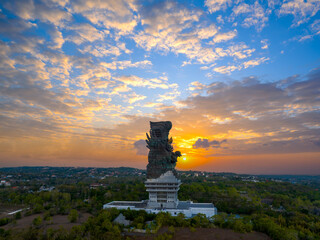 Statue of Hindu god Garuda Vishnu Kenkhana With blue sky and clouds and sunlight in the morning...
