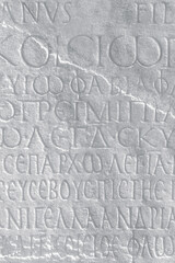 Historical text. Fragment of ancient law (imperial edict at Ancient Greek language), carved on marble block. Vintage background, cover page, monochrome. Kayseri, Turkey (Turkiye)