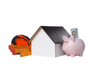 PNG,a wooden house with a ruler and a piggy bank, isolated on white background