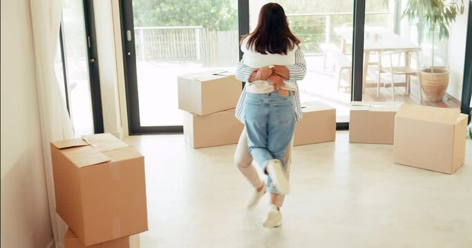 New home, moving and happy couple celebrate, hug and excited for house, real estate or property building purchase. Achievement celebration, boxes and homeowner people smile for relocation success