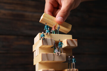 Toy little people with wooden parts close-up
