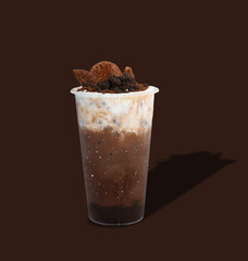Iced cacao crunchy. plastic cup of dark chocolate blended with cacao nibs and topped with chocolate granola.