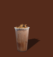 Iced cacao crunchy. plastic cup of dark chocolate blended with cacao nibs and topped with chocolate granola.