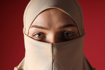 Naklejka premium Day for the elimination of violence against women, a girl in a burqa.