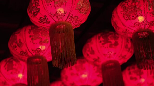 Traditional red asian lanterns illuminated at night. Chinese New Year Decorations