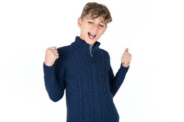 Ecstatic Caucasian teen boy shout loud yeah fist up raise win lottery