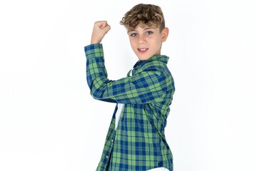 Portrait of powerful cheerful Caucasian teen boy showing muscles.