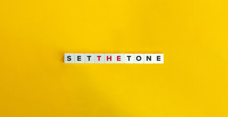 Set the Tone Phrase Phrase. Text on Block Letter Tiles on Yellow Background. Minimalist Aesthetics.