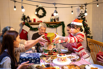 Happy people are celebrating on a table meal when christmas and new year at home.