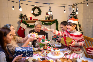 Happy people are celebrating on a table meal when christmas and new year at home.
