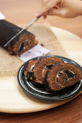 Homemade Chocolate roll cake on swiss dessert cake