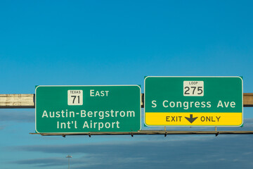 traffic sign austin bergstrom international airport and congress avenue exit only at highway 35, Austin, USA