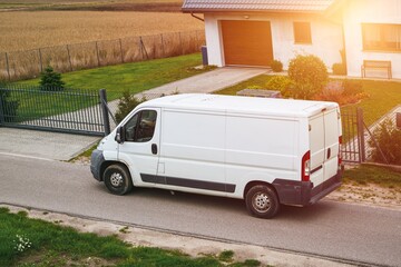 Commercial van delivers cargo to suburban custmers. Shipping parcels goods and orders in the...