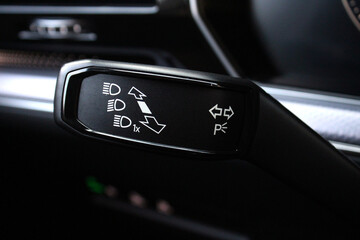 Car light switch. Headlight control stick. Car lighting control understeering switch. 