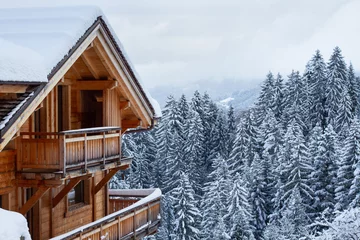 Foto op Canvas wooden house chalet in winter Alps, real estate, rental property for ski holidays © Song_about_summer