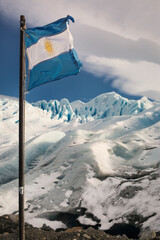 Argentinean flag waving in front of Perito Moreno Glacier