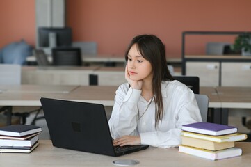 girl at the desk in school