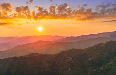 summer scenery mountain view from a highland hill to a beautiful sunset.