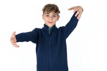 Caucasian teen boy looking at the camera smiling with open arms for hug. Cheerful expression embracing happiness.