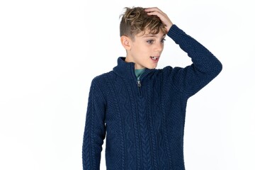 Caucasian teen boy surprised with hand on head for mistake, remember error. Forgot, bad memory concept.