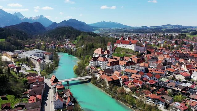 Aerial view of Fuessen with a view of the Lech river, the Benedictine monastery of St. Mang and the high castle. Ostallgaeu Swabia, Bavaria, Germany, Europe