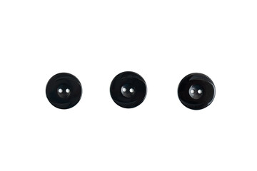 Large black plastic buttons on a white background