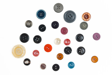 Buttons of various sizes and colors on a white background