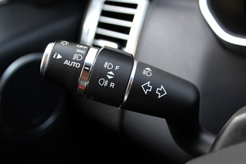 Modern Car light switch. Headlight control stick premium car. Lux Car lighting control understeering switch. 