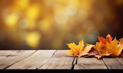 Naklejka na ściany i meble Autumn maple leaves on wooden table on bokeh background.Falling leaves natural background.Sunny autumn day with beautiful orange fall foliage in the park. copy space , banner