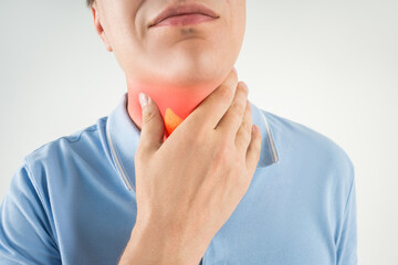 Thyroid gland inflammation, sore throat and cough, man with neck pain on gray background