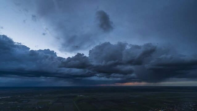 Timelapse of stormy clouds over the plain, topview, 4K