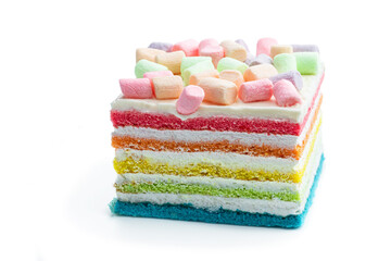 Obraz na płótnie Canvas Multicolored rainbow cake decorated with colored marshmallow isolated on white