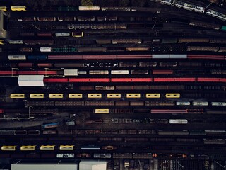 Aerial photo of railway lines, railway junction with trains. Freight wagons with goods on railroad...