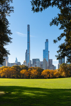 Central Park in Fall with Billionaires Row skyscrapers from Sheep Meadow. Midtown Manhattan, New York City