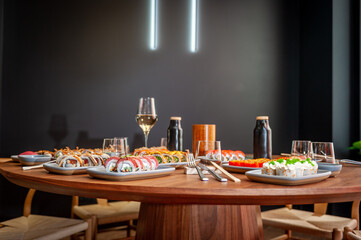 A set of sushi rolls on a table in a restaurant.