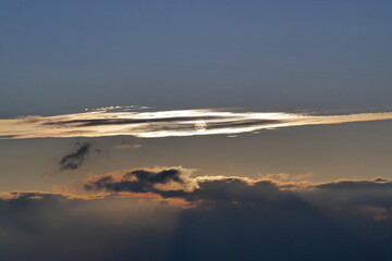Trail of sun and clouds