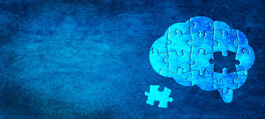 Brain shaped jigsaw puzzle on abstract blue wall background. A missing piece of the brain puzzle....