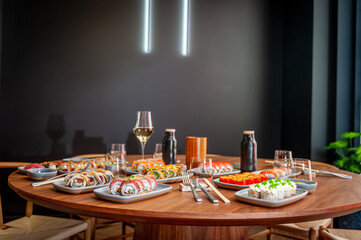 A set of sushi rolls on a table in a restaurant.