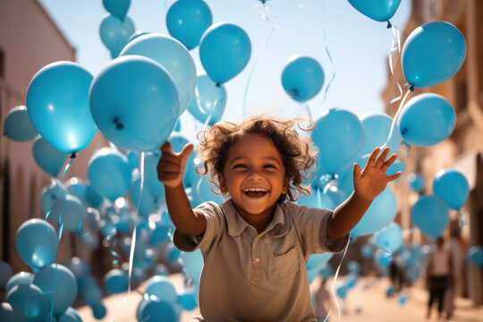 A happy child in balloon background represents the International Day of Charity