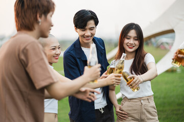 Image of group of friends celebrating and drinking beer together