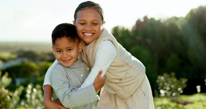 Brother, sister and face of children hug outdoor for love, care and happy bonding together in nature. Portrait of young girl, boy and kids embrace as siblings in park, garden and smile in sunshine