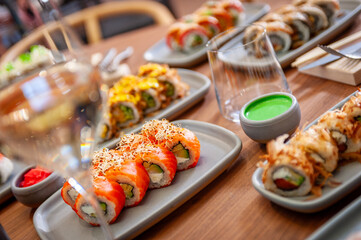 A set of sushi rolls on a table in a restaurant.